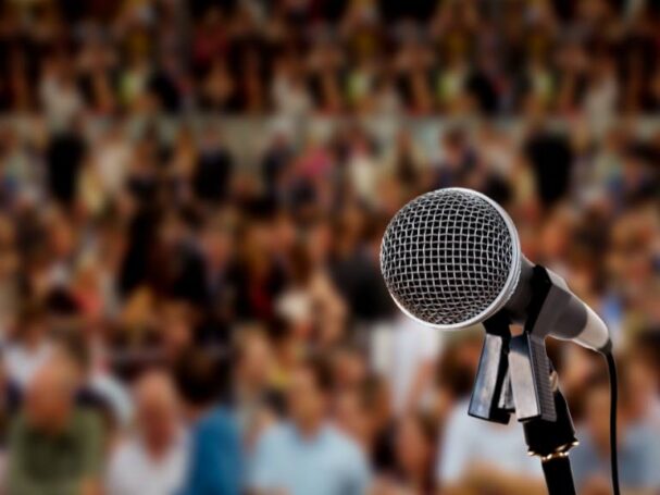 A Microphone Facing an Audience