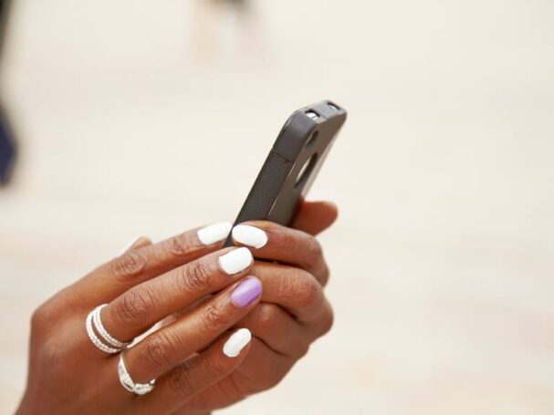 Feminine Hands Holding a Phone