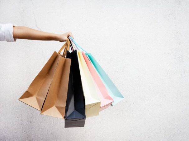 A Hand Holding Shopping Bags