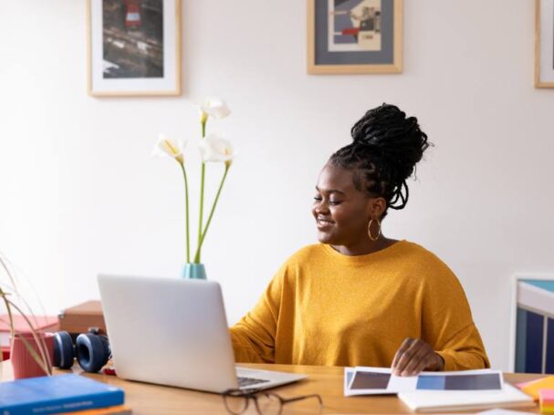 Female Entrepreneur Writing on a Laptop