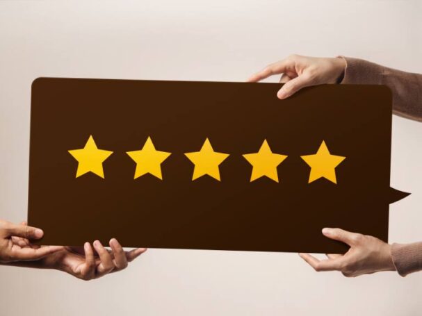 5 Star Customer Review Held by Two Persons